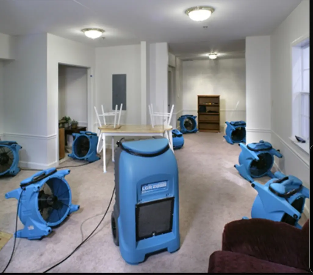 Air movers and dehumidifier setup for Water Damage Restoration in South Boston